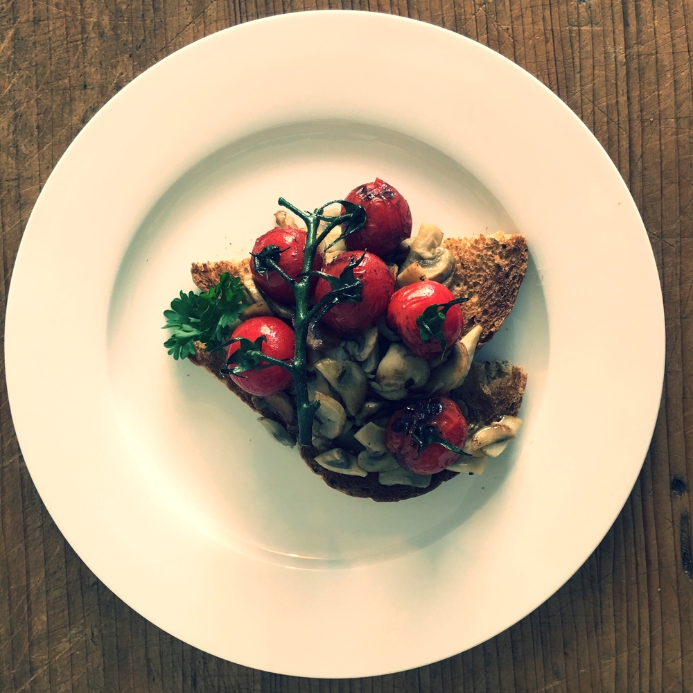 Mushrooms and vine tomatoes on toast